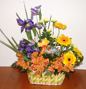 Flower arrangement in basket with giraffe