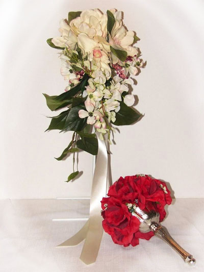White cascading bouquet and red bouquet with silver holder, a lovely keepsake!
